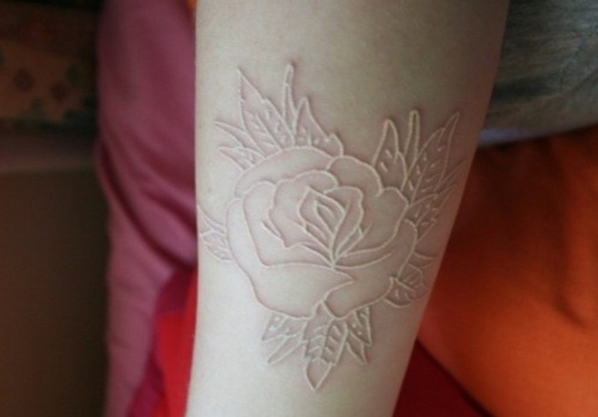 nice-rose-skin-scarification-on-arm-tattoo